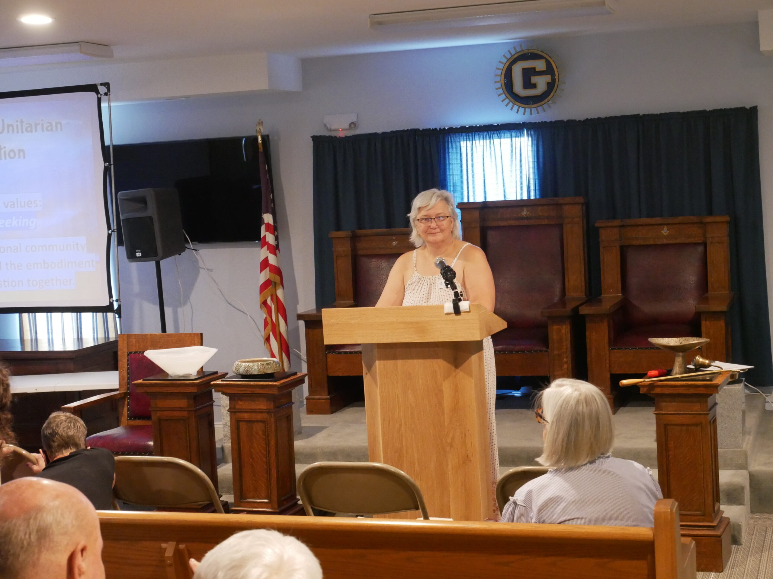 a woman standing at a podium